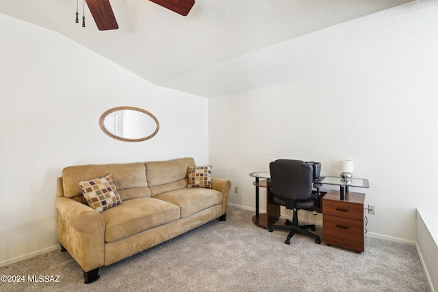 office featuring vaulted ceiling, ceiling fan, and light colored carpet