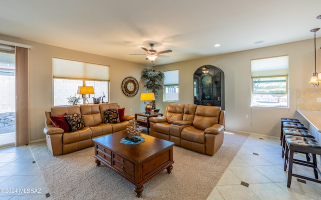 living room featuring ceiling fan and light tile patterned flooring