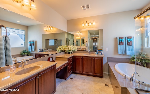 bathroom featuring vanity, tile patterned flooring, and plus walk in shower