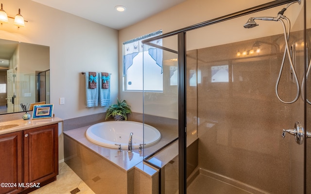 bathroom featuring vanity, tile patterned flooring, and shower with separate bathtub