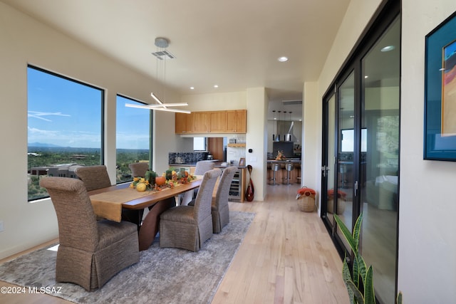 dining area with light wood-type flooring