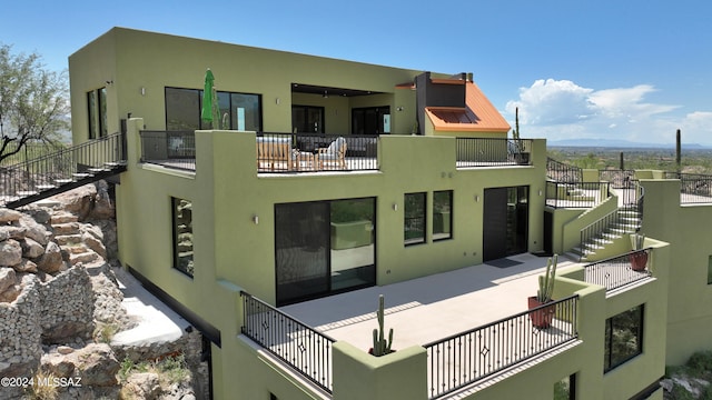 exterior space featuring a balcony and a mountain view