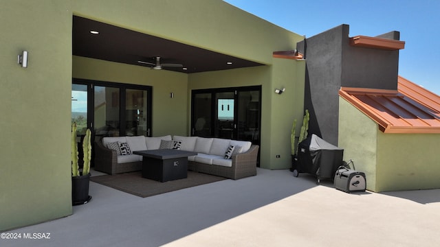 view of patio with an outdoor living space and ceiling fan