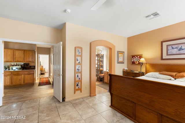 bedroom with light wood-type flooring and ceiling fan