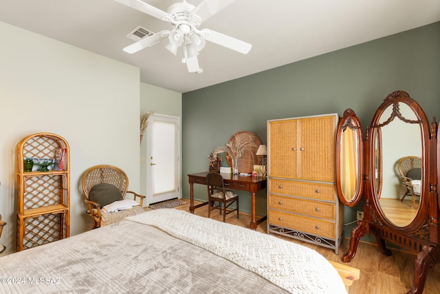 bedroom with ceiling fan and wood-type flooring