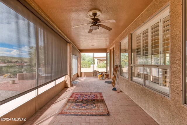 sunroom / solarium with ceiling fan