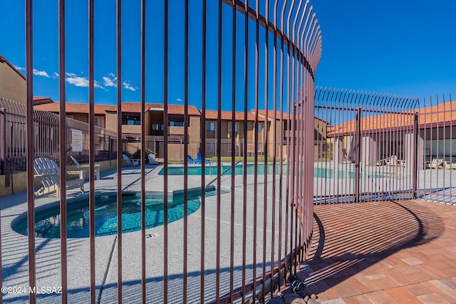 view of swimming pool with a patio area