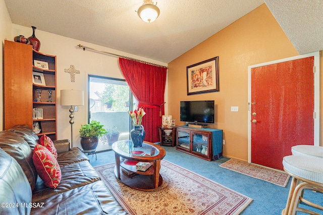 living room featuring a textured ceiling, carpet flooring, and vaulted ceiling