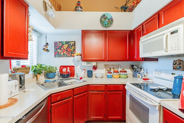 kitchen featuring sink and white appliances