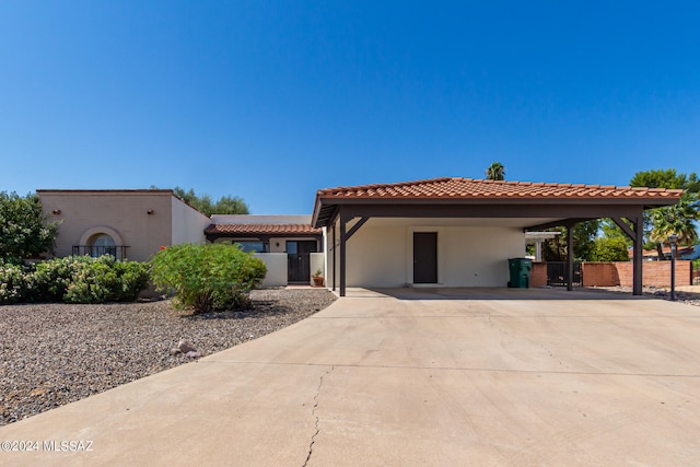 mediterranean / spanish home with a carport