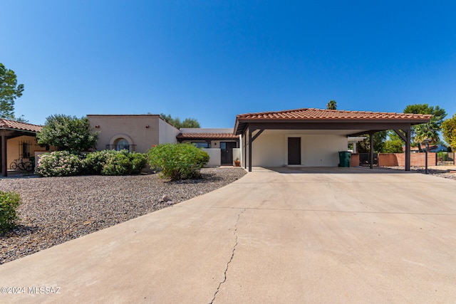 mediterranean / spanish home with a carport