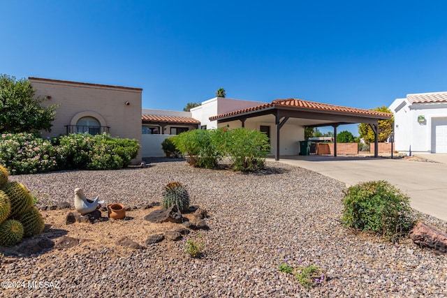 mediterranean / spanish-style home with a carport