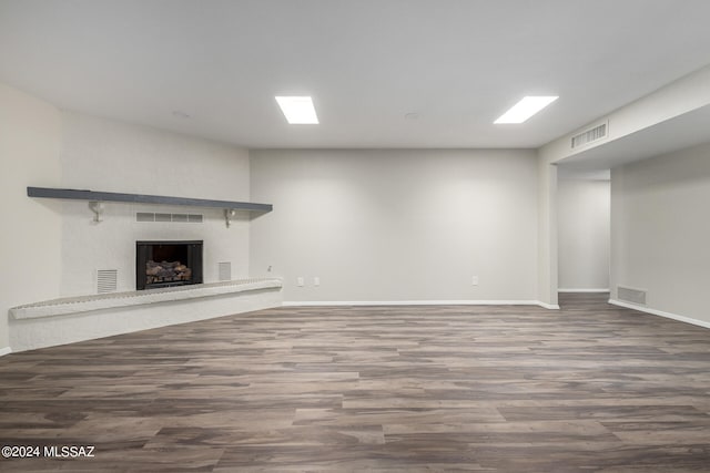 unfurnished living room with hardwood / wood-style floors