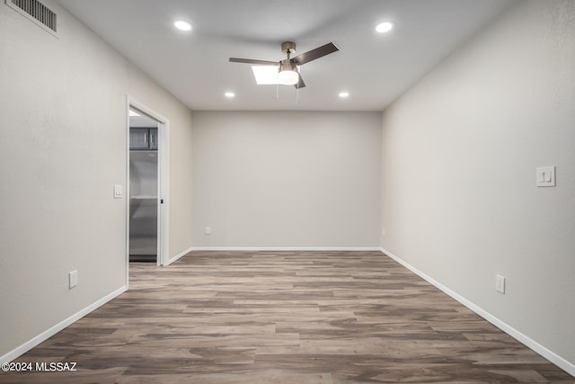 unfurnished room with wood-type flooring and ceiling fan