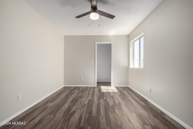 unfurnished room featuring dark hardwood / wood-style flooring and ceiling fan