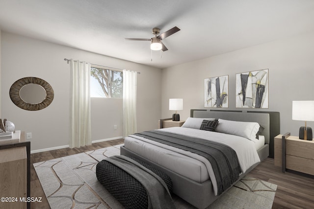 bedroom featuring dark hardwood / wood-style flooring and ceiling fan