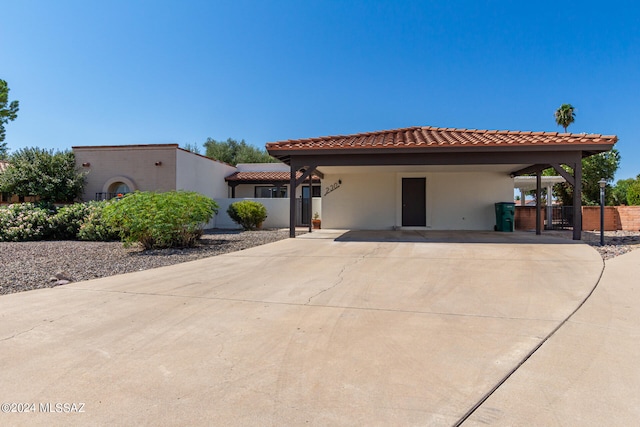 mediterranean / spanish-style house featuring a carport