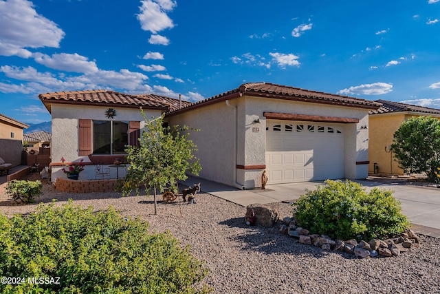 view of front of property with a garage