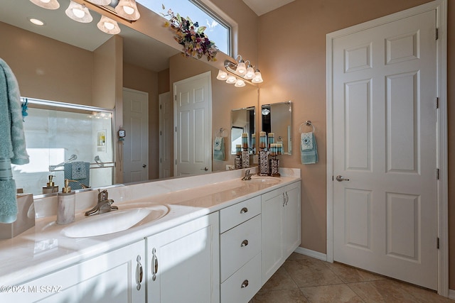 bathroom with tile patterned flooring, vanity, and an enclosed shower