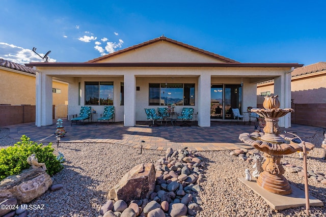 back of house featuring a patio area