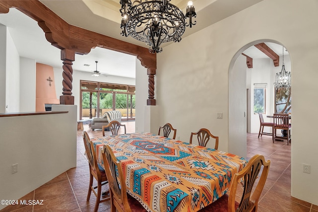 tiled dining room with beamed ceiling and ceiling fan with notable chandelier