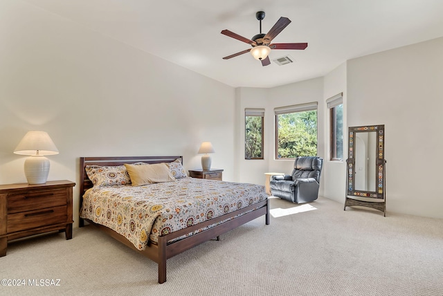 bedroom with ceiling fan and carpet floors