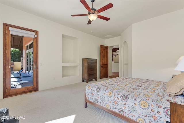 bedroom with light colored carpet, access to outside, and ceiling fan