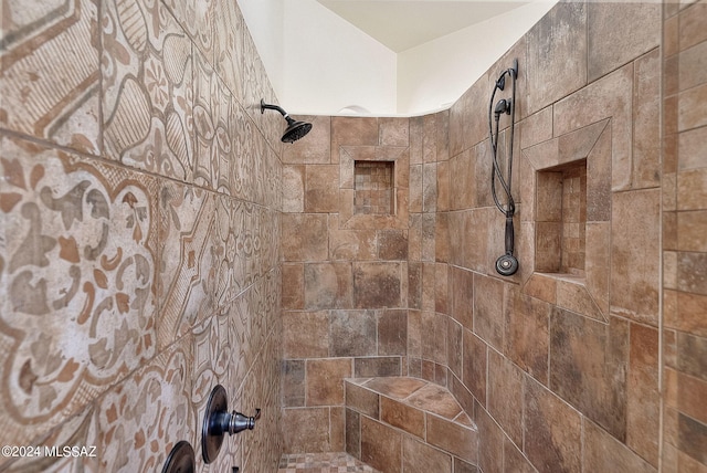 bathroom featuring tiled shower