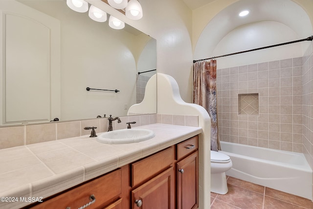 full bathroom with vanity, toilet, tile patterned floors, and shower / bathtub combination with curtain