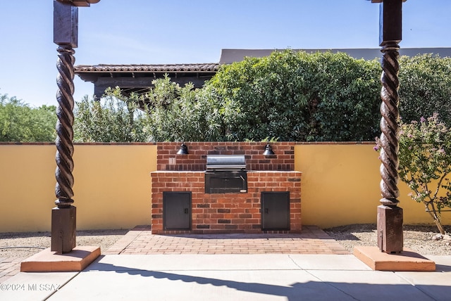 view of patio with a grill