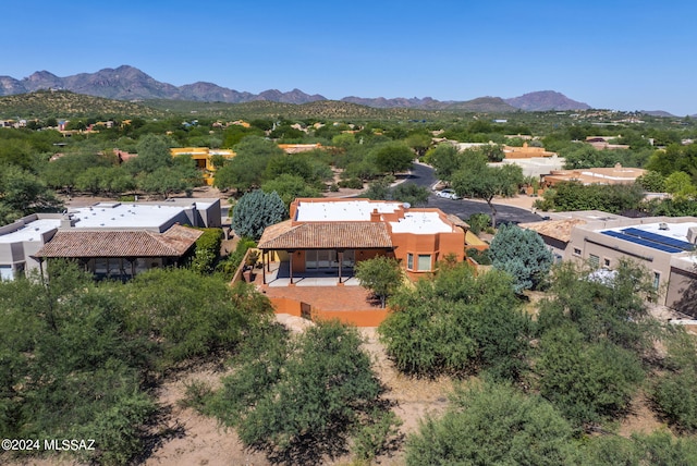 birds eye view of property with a mountain view