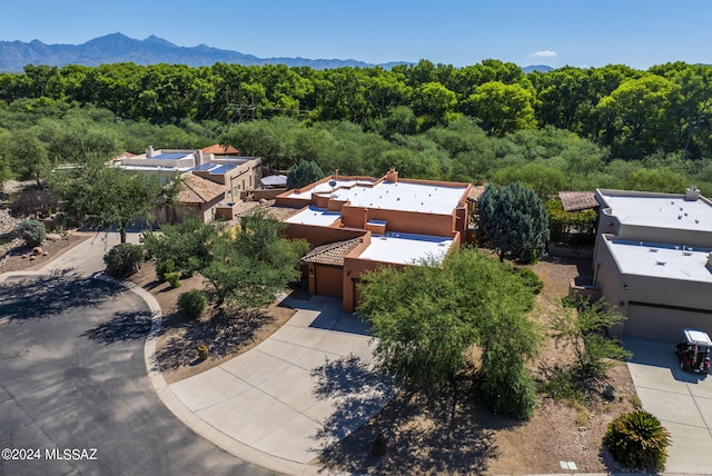 birds eye view of property with a mountain view