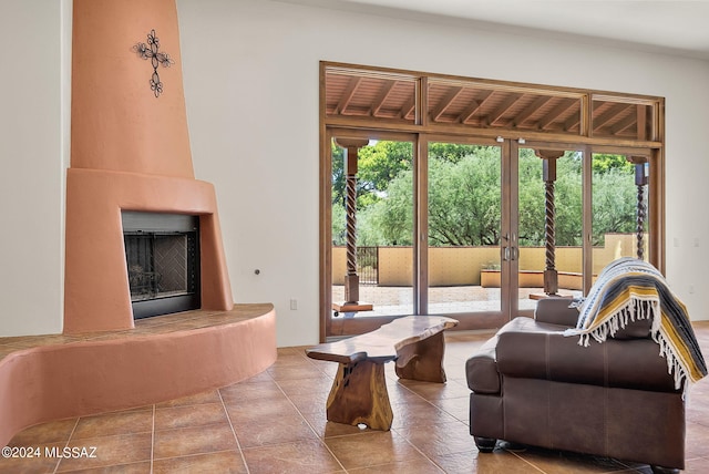 tiled living room with a large fireplace