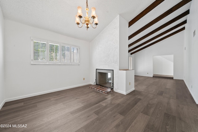 unfurnished living room with a notable chandelier, dark hardwood / wood-style floors, beam ceiling, and high vaulted ceiling