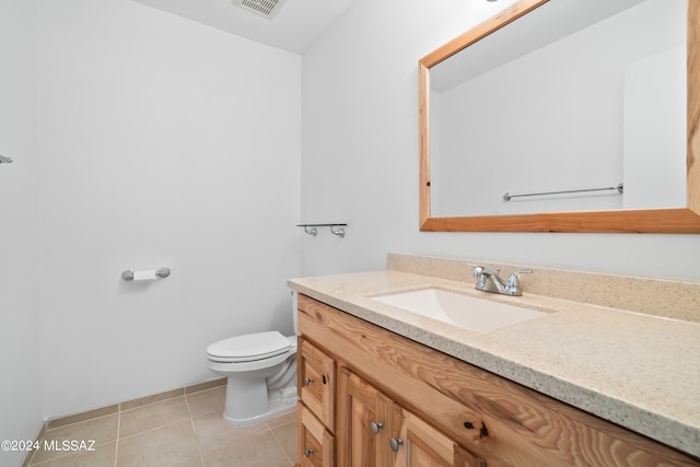 bathroom with tile patterned floors, vanity, and toilet