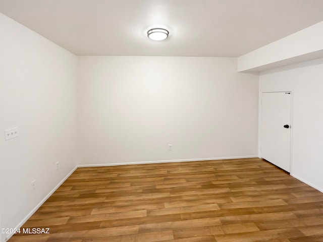 spare room with hardwood / wood-style floors