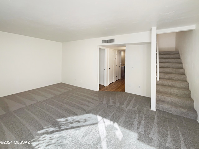 interior space featuring dark colored carpet