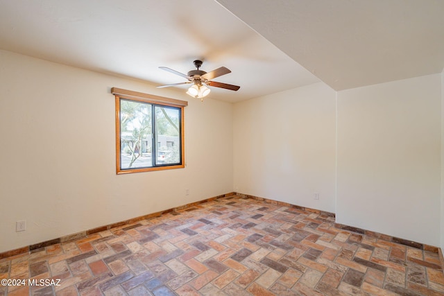 unfurnished room with ceiling fan