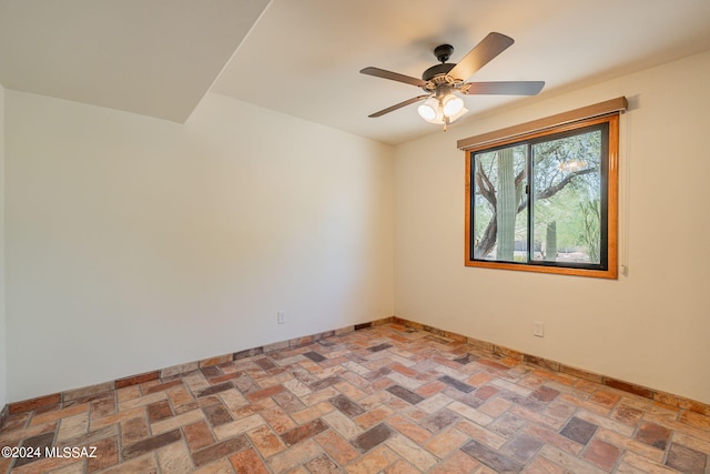 spare room featuring ceiling fan