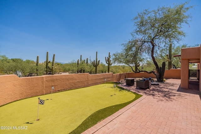 view of yard with an outdoor living space and a patio