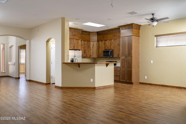 bathroom with vanity, a shower with shower door, and hardwood / wood-style flooring