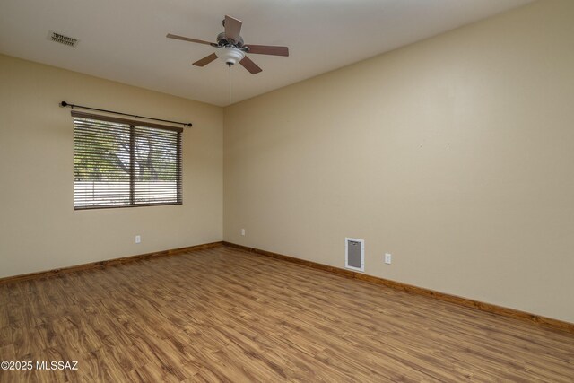 bedroom with ceiling fan and dark wood-type flooring