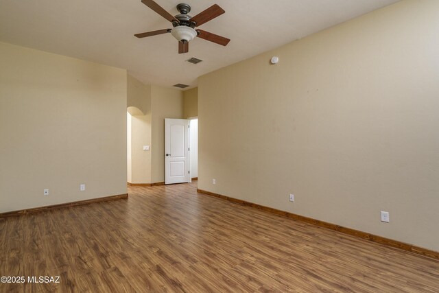 full bathroom with shower / bath combo, toilet, wood-type flooring, and vanity