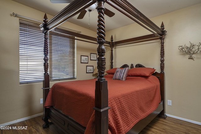 bedroom featuring dark wood-type flooring and ceiling fan