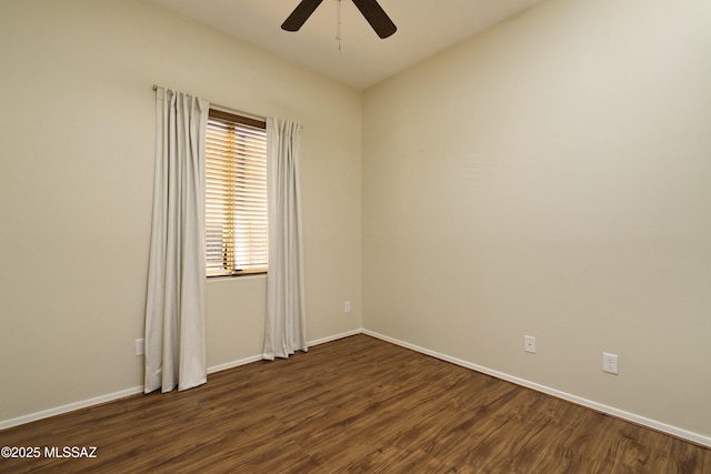 unfurnished room with ceiling fan and dark hardwood / wood-style flooring