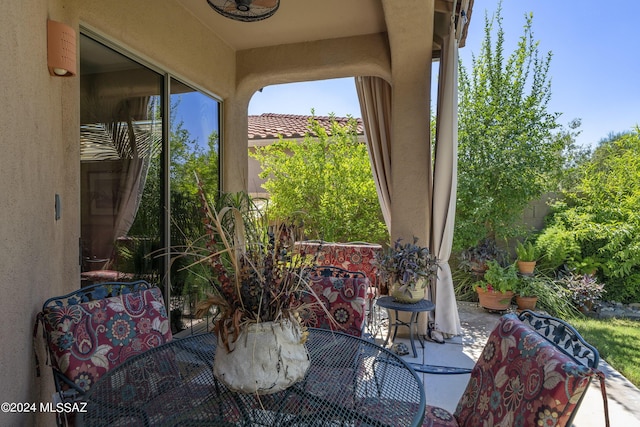 view of patio / terrace featuring ceiling fan