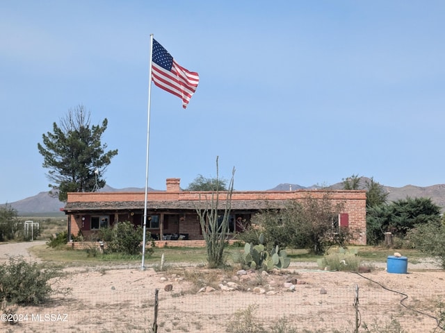 back of house featuring a mountain view