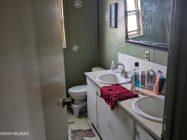 bathroom featuring vanity and toilet