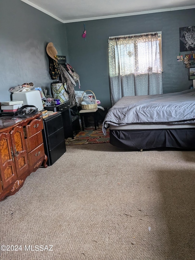 bedroom with carpet and ornamental molding