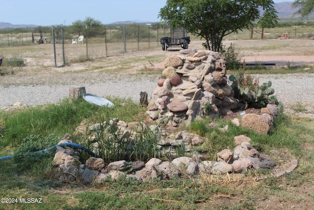 view of yard with a rural view